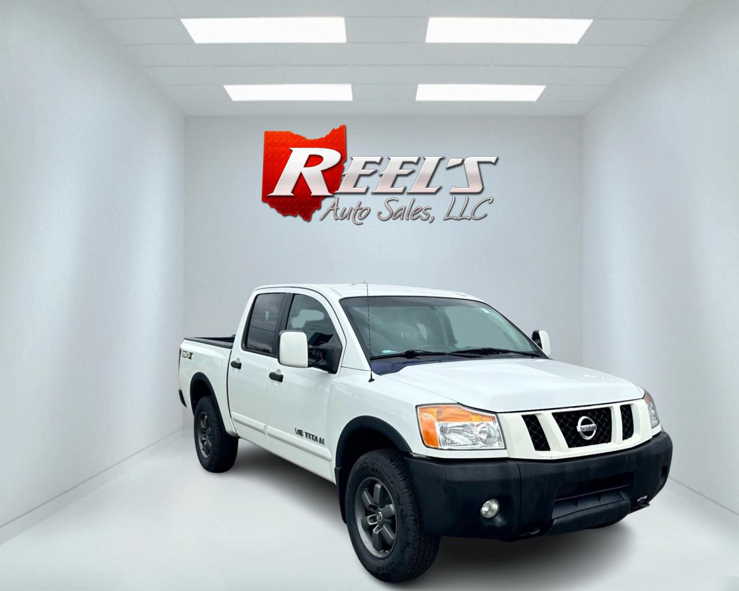 2013 White /Black Nissan Titan Pro-4X (1N6AA0EC0DN) with an 5.6L DOHC 32V V8 engine, Automatic transmission, located at 547 E. Main St., Orwell, OH, 44076, (440) 437-5893, 41.535435, -80.847855 - This 2013 Nissan Titan Pro-4X Crew Cab is a capable and well-equipped full-size pickup truck. It features a powerful 5.6L Endurance V8 engine paired with a 5-speed automatic transmission, a locking rear differential for improved traction, and a maximum towing capacity of 9,300 pounds. The truck is l - Photo #2